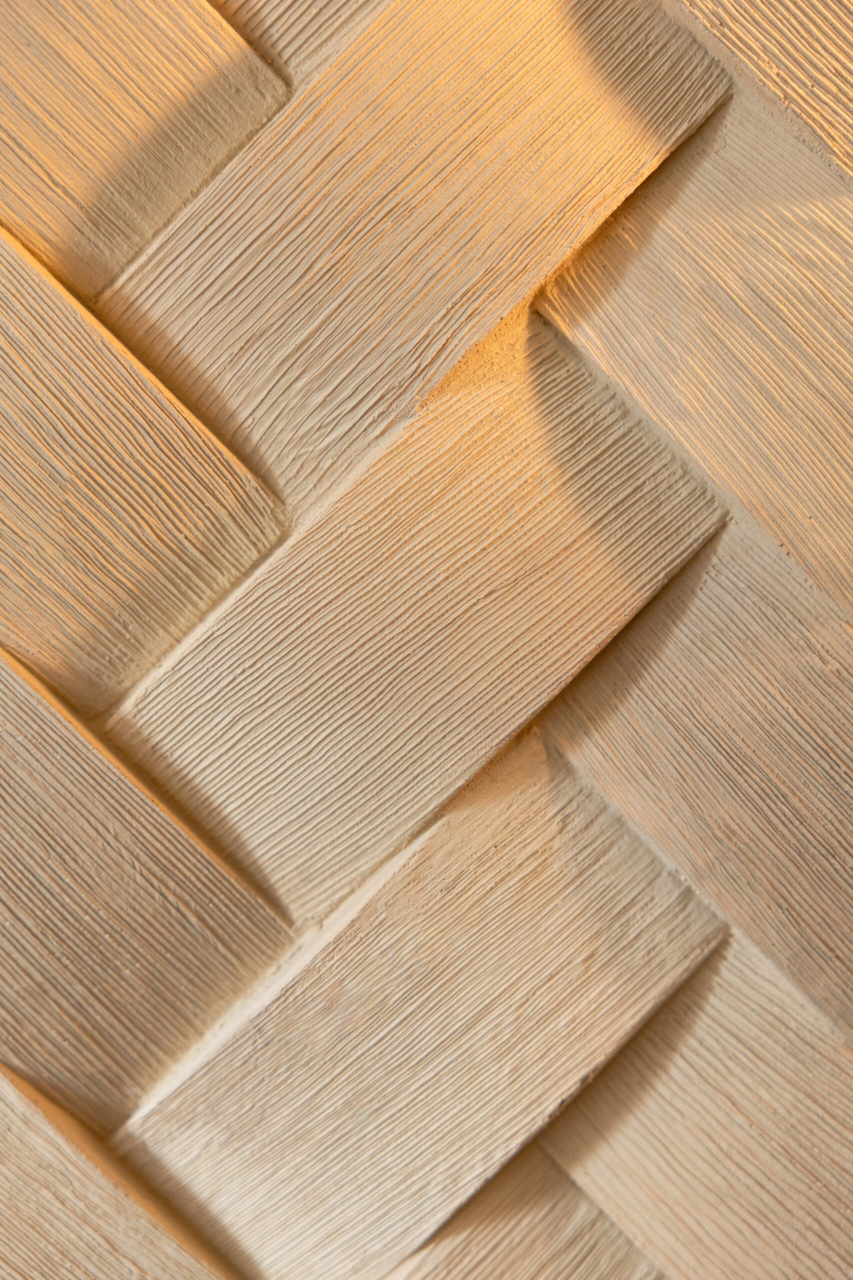 Close-up of herringbone natural stone or wood tile pattern
